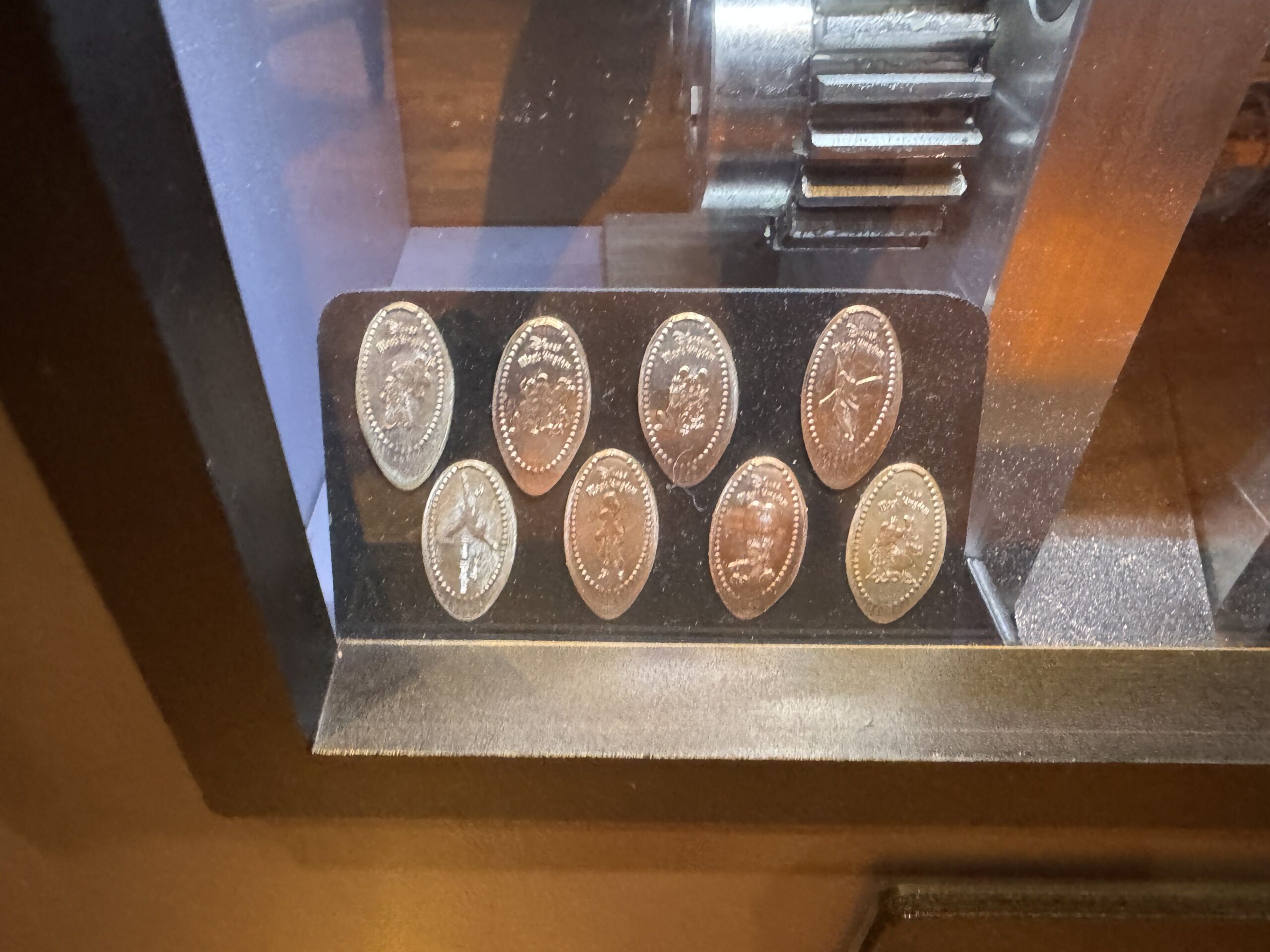An upgraded pressed penny machine was spotted in Curtain Call Collectibles at Magic Kingdom